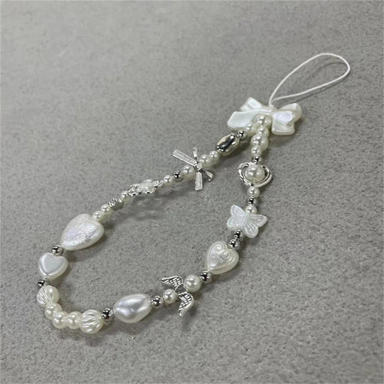 Perles coréennes mignonnes en forme de cœur et de nœud blanc. Chaîne de téléphone avec cordon de suspension anti-perte. 